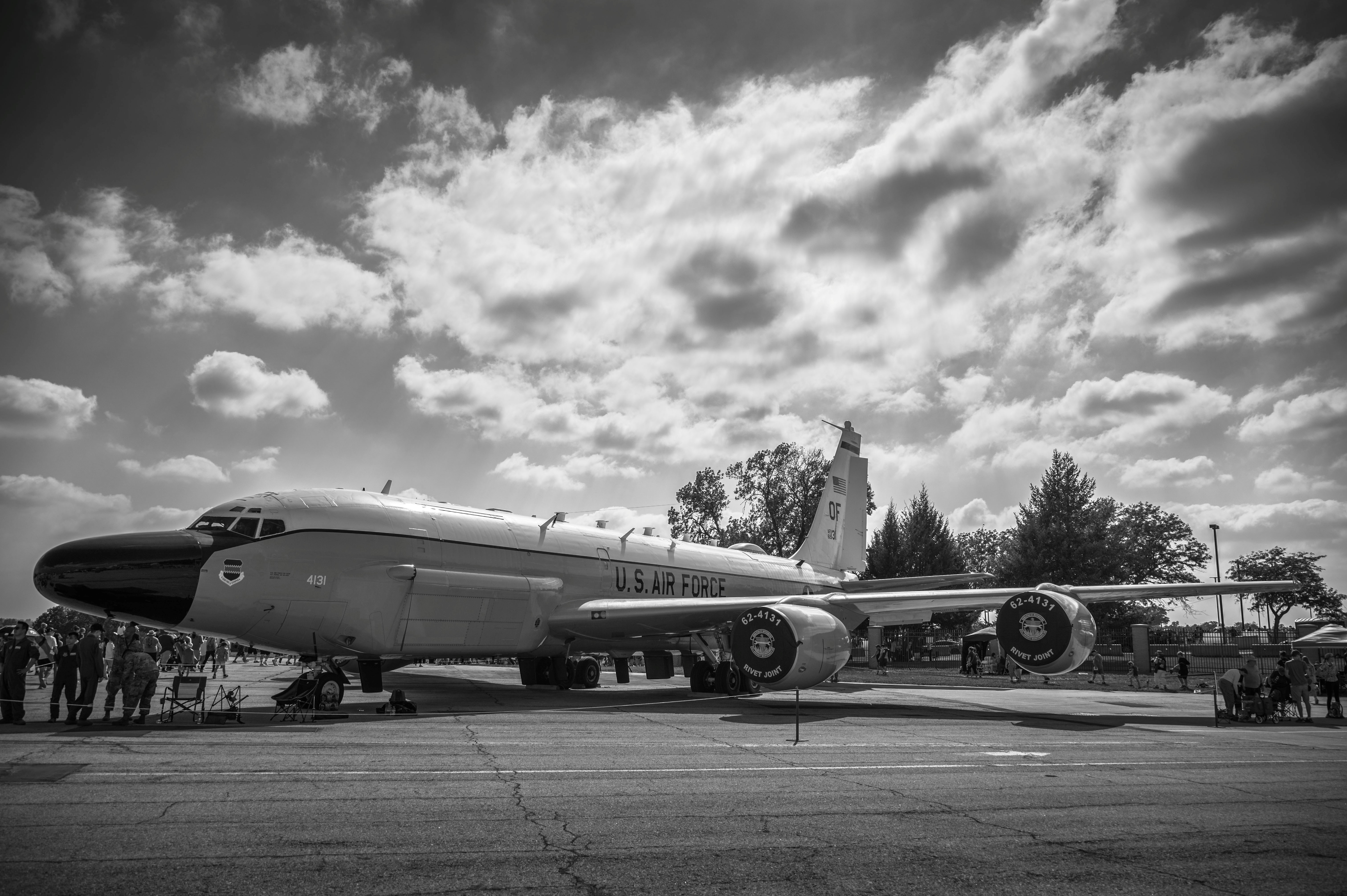Military aircraft display with people nearby